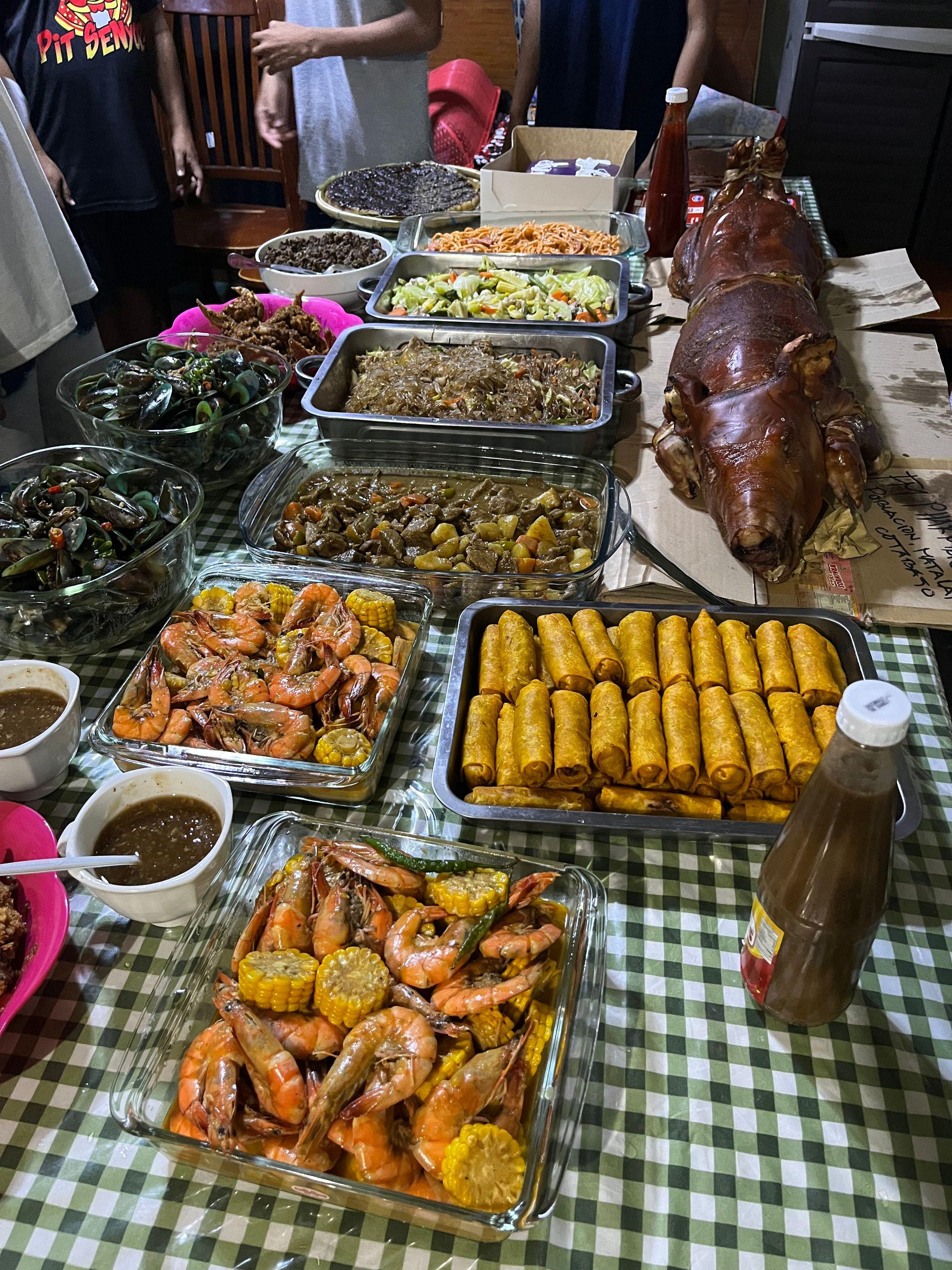 Table full of filipino dishes